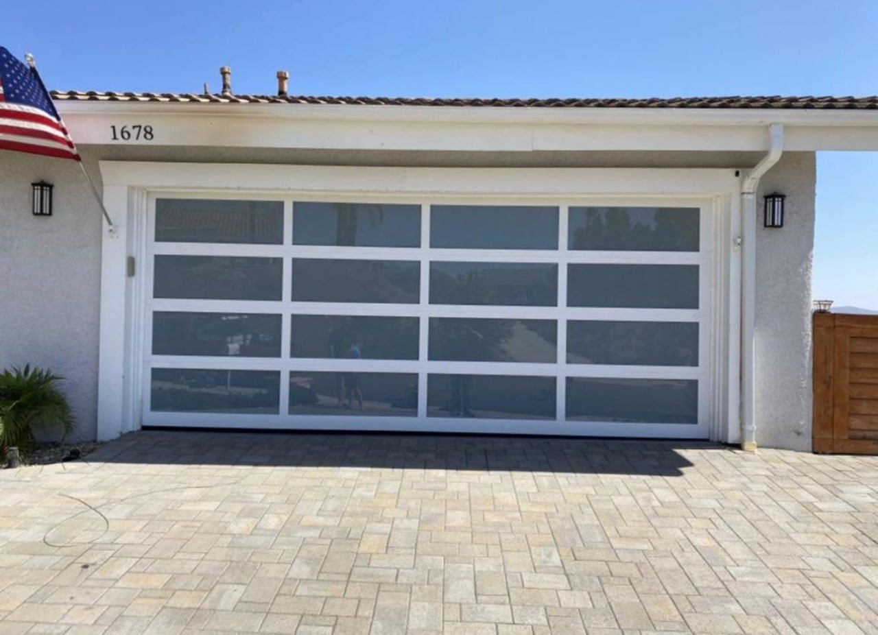 Modern garage door installed by A1 Garage Door Repair Texas on a home exterior